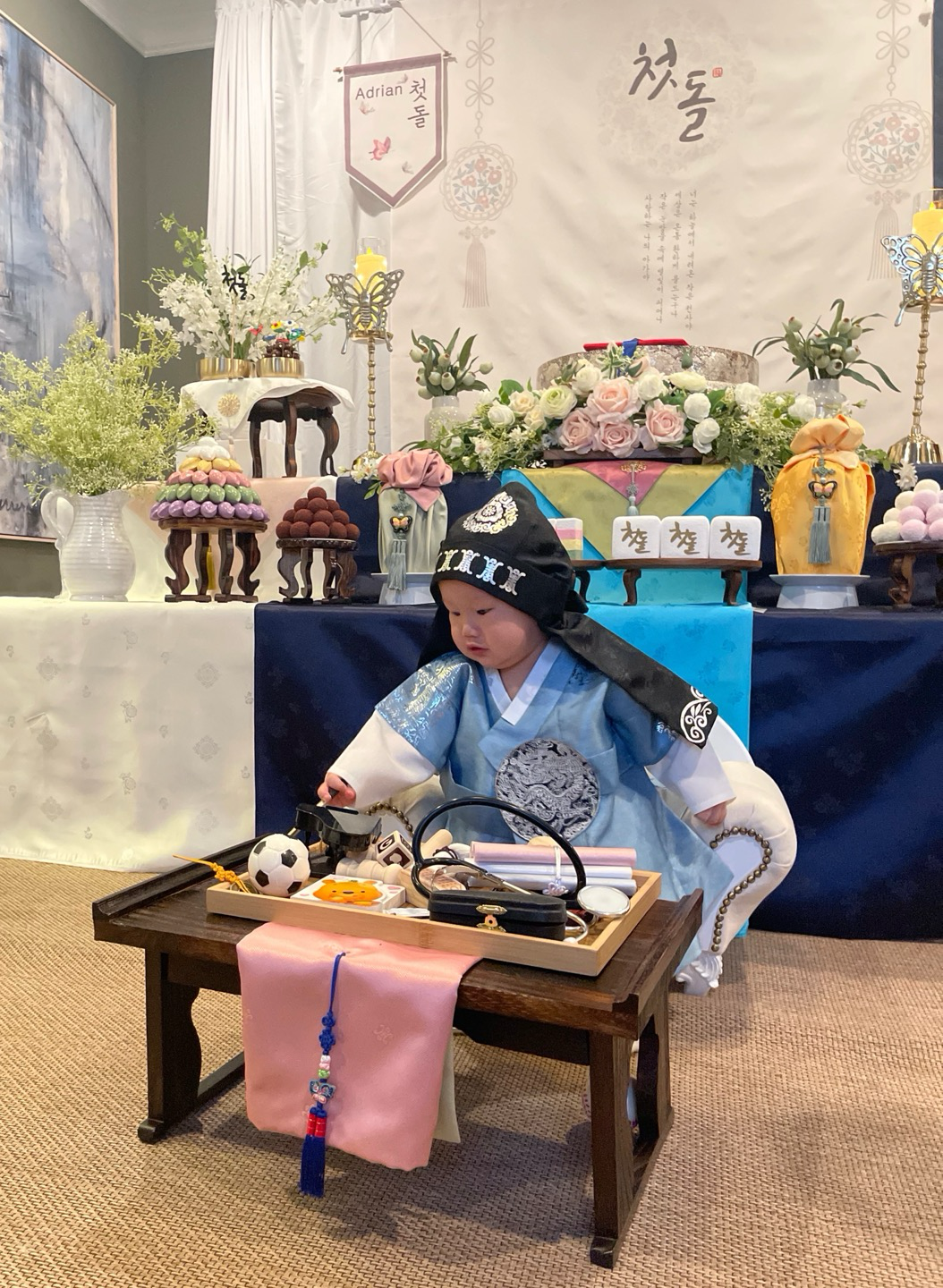 Child in hanbok at traditional first birthday dol celebration