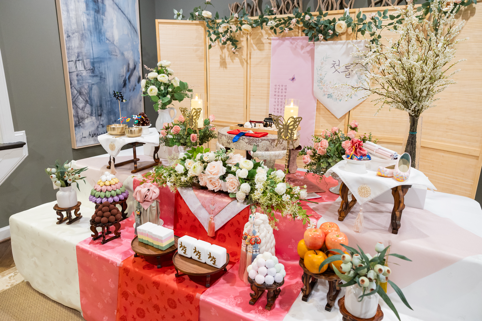 Traditional first birthday celebration table with cake and florals